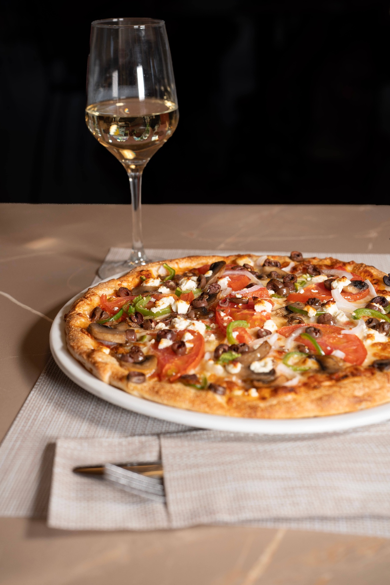 Vegetarian pizza with feta, olives and peppers